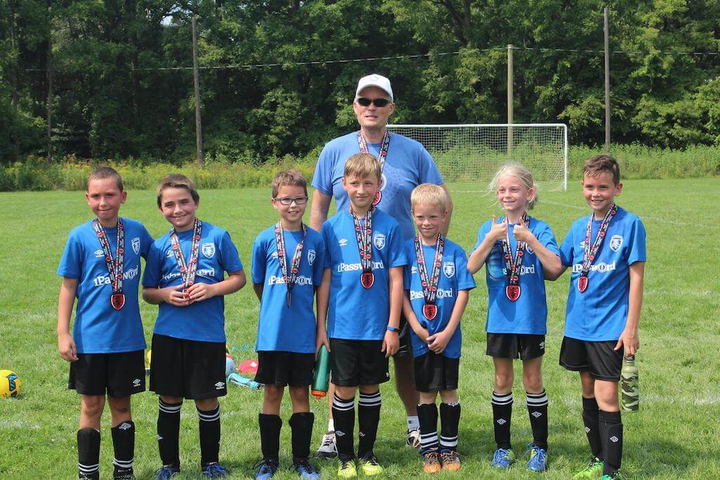 Coach Dave Teare with St Thomas Soccer Club