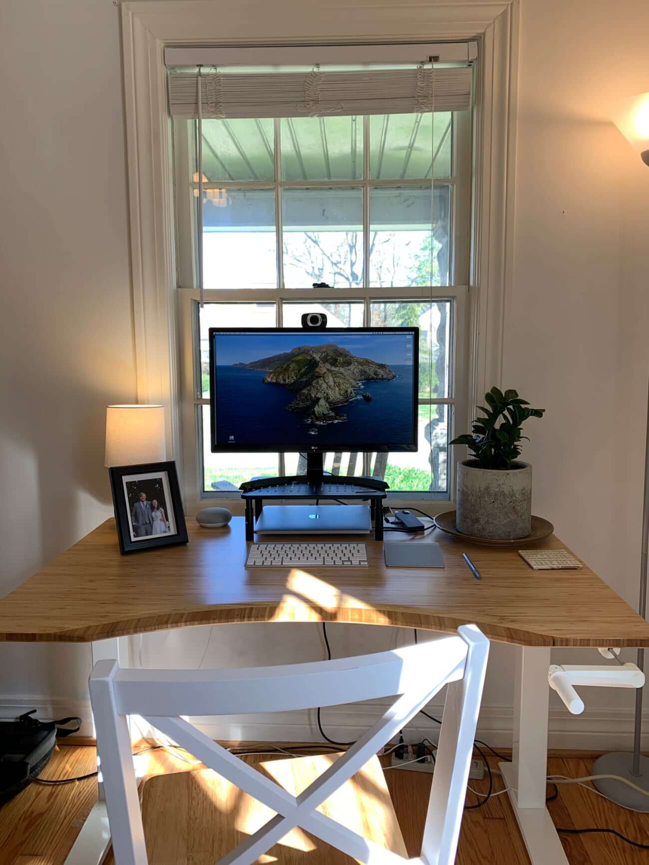 Image of Chris's desk in front of a large window