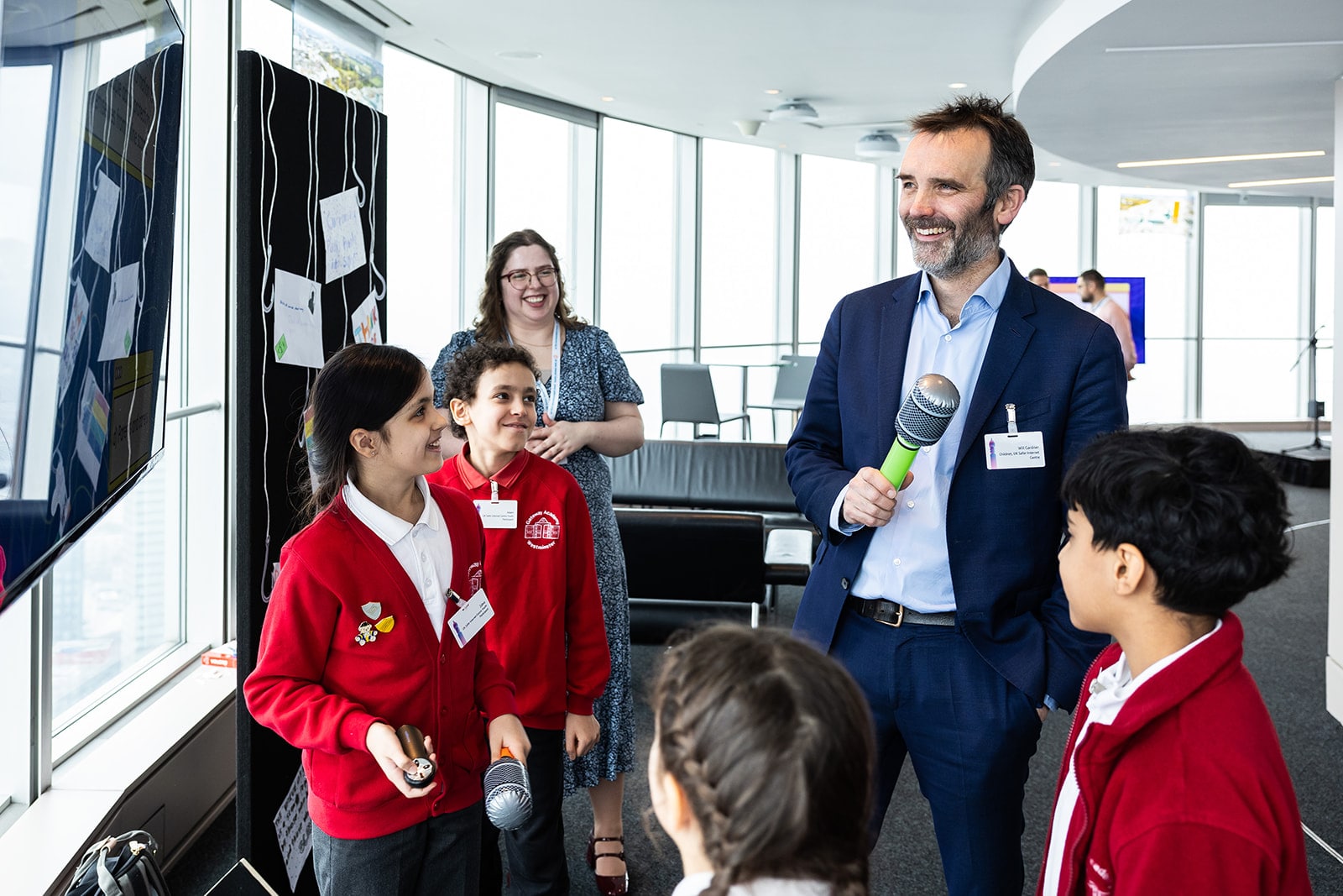 Students talking with an interviewer. Students talking with an interviewer.