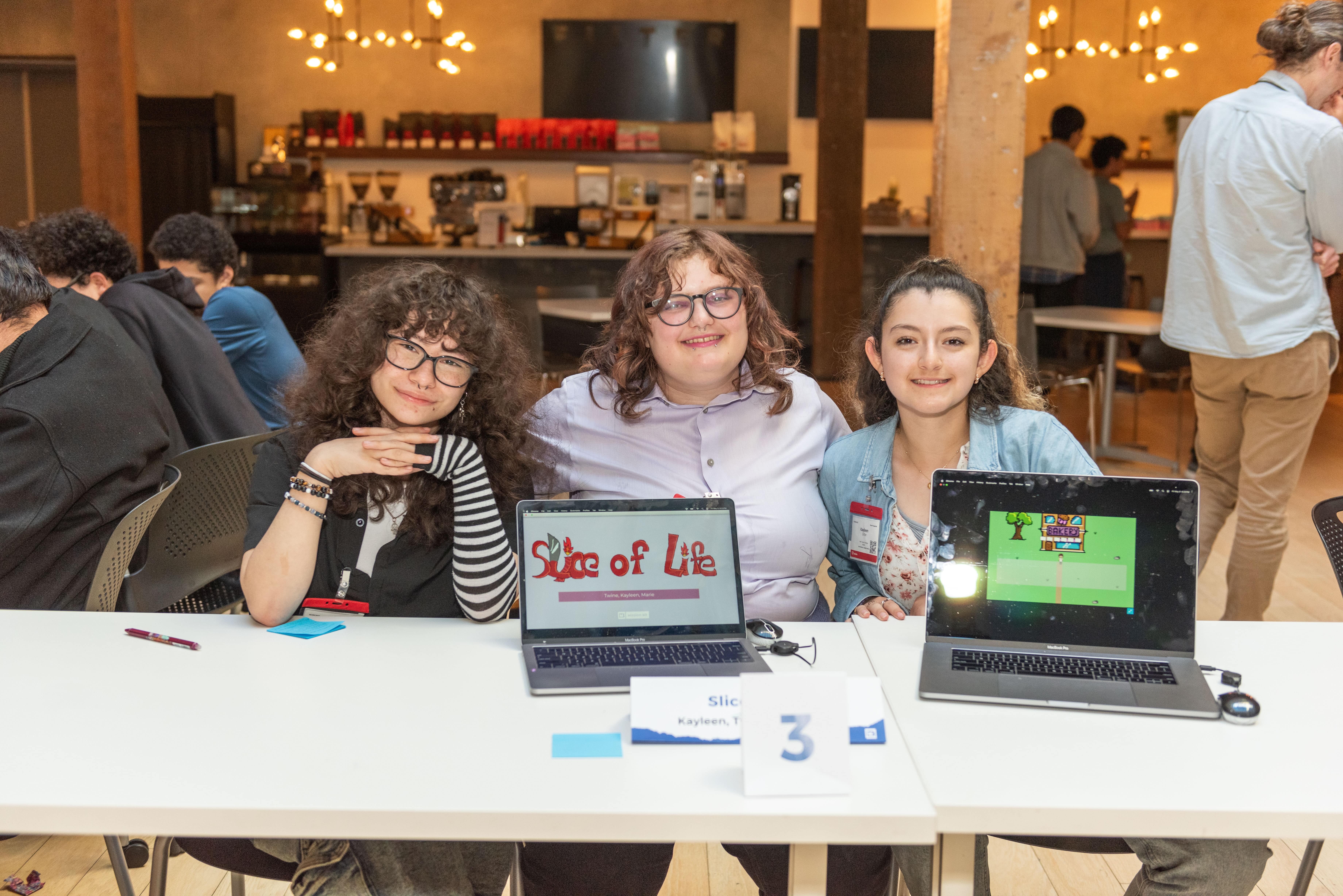 Students posing with laptops. Students posing with laptops.